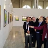Cuadros pintados al óleo de Vietnam captan mirada del público en Argelia