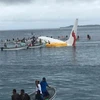 Registran cuatro vietnamitas a bordo del avión caído en una laguna de Micronesia