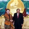 Secretario general del Partido y presidente de Laos recibe a titular del parlamento de Vietnam