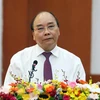 Premier de Vietnam insta al sector financiero a apoyar la restauración económica