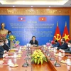 Vietnam y Laos fortalecen el intercambio de teorías entre dos partidos 