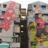 Murales coloridos embellecen antiguos edificios en Ciudad Ho Chi Minh