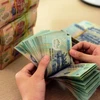 Instan a garantizar operaciones seguras del mercado financiero y monetario en Vietnam