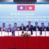 Hanoi y Vientiane firman acuerdos para impulsar el comercio