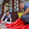[Foto] Artesanos vietnamitas fabrican banderas en ocasión del Día Nacional