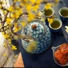 Costumbre vietnamita de disfrutar de té y frutas confitadas durante el Tet