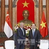 Le président Tran Dai Quang reçoit le Premier ministre Lee Hsien Loong