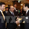 Le PM Nguyen Xuan Phuc au colloque avec les entreprises des TI du Japon