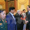 Rencontre du président Tran Dai Quang avec des soldats volontaires vietnamiens au Cambodge 