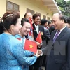 Le Premier ministre Nguyen Xuan Phuc rencontre des Vietnamiens résidant en Thaïlande. Photo: VNA