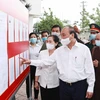 Le président Nguyen Xuan Phuc en tournée dans les districts de Cu Chi et Hoc Mon à HCM-Ville