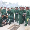 Dien Bien : inhumation des restes de 13 soldats volontaires et d'experts vietnamiens tombés au Laos