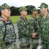 Le président Trân Dai Quang travaille avec le ministère de la Défense