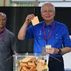 Législatives en Malaisie: le scrutin s’annonce serré 