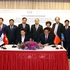 Le PM assiste à la signature d'un accord entre le groupe TH et son partenaire chinois