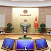 Le PM Nguyen Xuan Phuc: conjuguer d’efforts pour éviter la chute de l'économie nationale