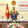 Le président de l'AN Vuong Dinh Hue préside la 7e réunion du Conseil électoral national