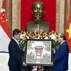 Le président Nguyen Xuan Phuc rencontre le président du parlement de Singapour Tan Chuan-Jin