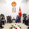 Le vice-Premier ministre Tran Hong Ha reçoit un responsable de China Energy