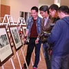 Exposition de photos et de documents sur la promotion des droits de l’homme au Vietnam