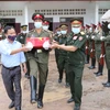 Rapatriement des restes de trois soldats volontaires et d'experts vietnamiens tombés au Laos