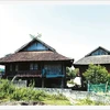 Le khau cút, symbole décoratif des maisons des Thai noirs