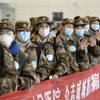 Медработники направляются на лечение пациентов в больнице Ухани, Китай, 28 января 2020 года. (Фото: Синьхуа/ВИА)