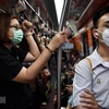 Жители Бангкока носят маски во избежание заражение вируса. (Фото: AFP/ВИА)