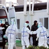 Медработники принимают пациентов, инфицированных острыми респираторными инфекциями COVID-19, в полевом госпитале в Ухане, провинция Хубэй, Китай, 12 февраля 2020 года. (Фото: Синьхуа/ВИА)