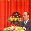 Премьер-министр Нгуен Суан Фук выступает на конференции налогового сектора 26 февраля. (Фото: ВИА)
