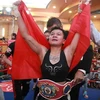 Вьетнамка Нгуен Тху Чу Ньи празднует победу в дисциплине WBO Asia Pacific по боксу в минимальном весе. (Фото: Нам Чунг/ВИА)