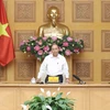 Премьер-министр Нгуен Суан Фук выступает на встрече. (Фото: Тхонг Нят/ВИА)