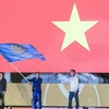 Министр культуры, спорта и туризма Вьетнама Нгуен Нгок Тхьен получил флаг для проведения спортивных игр SEA Games 31. (Фото: Хоанг Линь/ВИА)