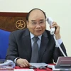 Премьер-министр Нгуен Суан Фук 26 марта провел телефонные переговоры с лаосскими и камбоджийским руководителями. (Фото: ВИА)