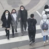 Люди в Оттаве носят маски (Фото: Синьхуа)