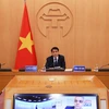 Председатель Народного комитета Ханоя Нгуен Дык Тьюнг также принял участие из столицы Вьетнама - Ханоя. (Фото: Лам Кхань/ВИА)