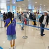 Пассажиры в международном аэропорту Нойбай. (Фото: ВИА)