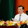 Министр финансов Динь Тьен Зунг выступает на конференции в Ханое 7 июля (Фото: ВИА)
