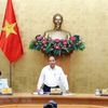 Премьер-министр Нгуен Суан Фук (в центре) (Источник: ВИА)