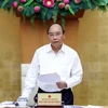 Премьер-министр Нгуен Суан Фук выступает на встрече, состоявшейся 23 июля, с властями провинции Дакнонг. (Фото: ВИА)