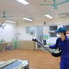 Распыление дезинфекции для предотвращения для предотвращения распространения коронавируса в Ханое. (Фото; ВИА)