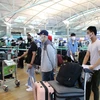 Граждане Вьетнама ждут обработки посадки в аэропорту Республики Корея (Фото: ВИА)