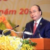 Член Политбюро, премьер-министр Нгуен Суан Фук выступает на церемонии открытия (Фото: ВИА)