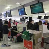 Граждане Вьетнама завершают процедуры полета в международном аэропорту Сиднея. (Фото: ВИА)
