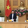Заместитель премьер-министра, министр иностранных дел Фам Бинь Минь (стоит) выступает на мероприятии (Фото: ВИА)