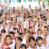Школьники из центральной провинции Нгеан с радостью присоединяются к играм на церемонии в честь Международного дня девочек 11 октября (Фото: ВИА)