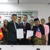 На церемонии подписания между Вьетнамской бизнес-ассоциацией Малайзии и малайзийской компанией Blue Ocean Capital Group Berhad (Фото: ВИА)
