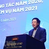 Заместитель премьер-министра, министр иностранных дел Фам Бинь Минь выступает на конференции (Фото: ВИА)