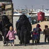 Женщины и дети замечены в лагере Аль-Хол в сирийской провинции Хасаке 28 января 2021 г. (Фото: AFP/ВИА)