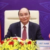 Президент Нгуен Суан Фук на церемонии открытия онлайн-саммита по климату 22 апреля (Фото: ВИА)